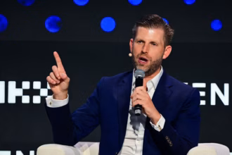 Eric Trump believes stablecoins could safeguard the US dollar’s strength, highlighting concerns and debates surrounding his family's crypto initiatives