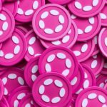 Polkadot logo with DOT tokens representing native algorithmic stablecoin proposal