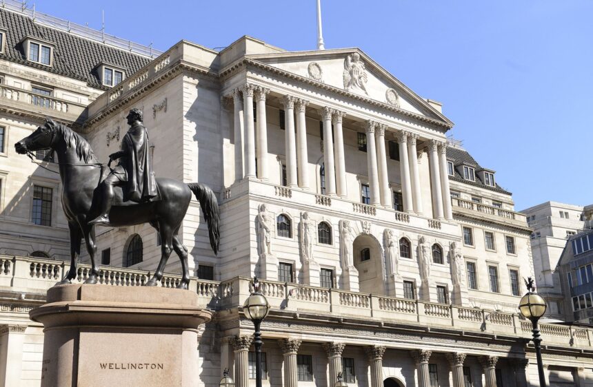 Bank of England building with digital stablecoin icons